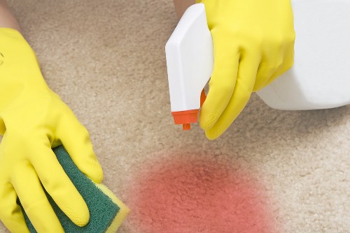 Cleaner reviewing a customer complaint form during a service check