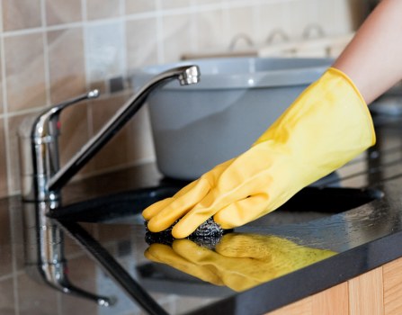 Cleaner preparing a Westhampstead Airbnb flat for the next guest