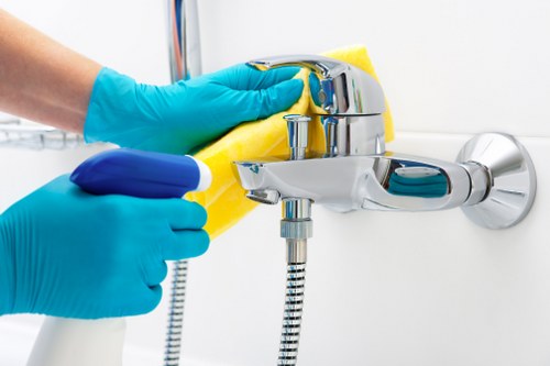 Trained cleaning staff working carefully with safety procedures in place
