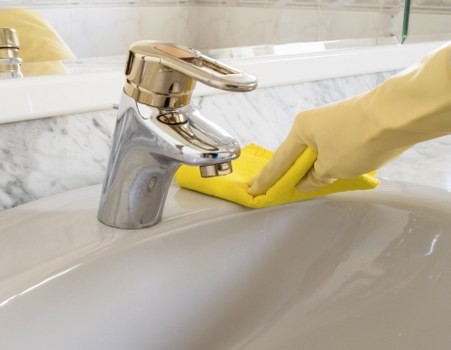 Supervisor reviewing safe cleaning procedures with staff